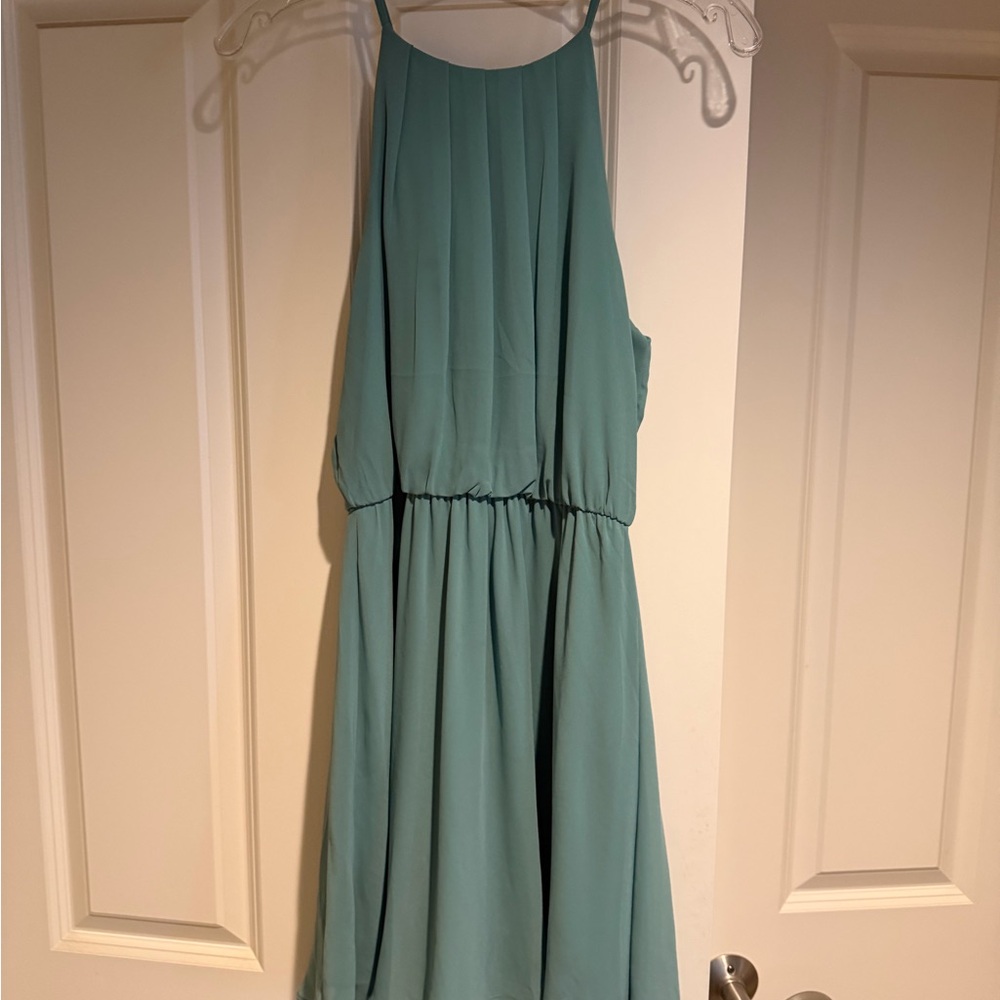 Lush sage green halter neck mini dress, perfect for semi formal or homecoming.